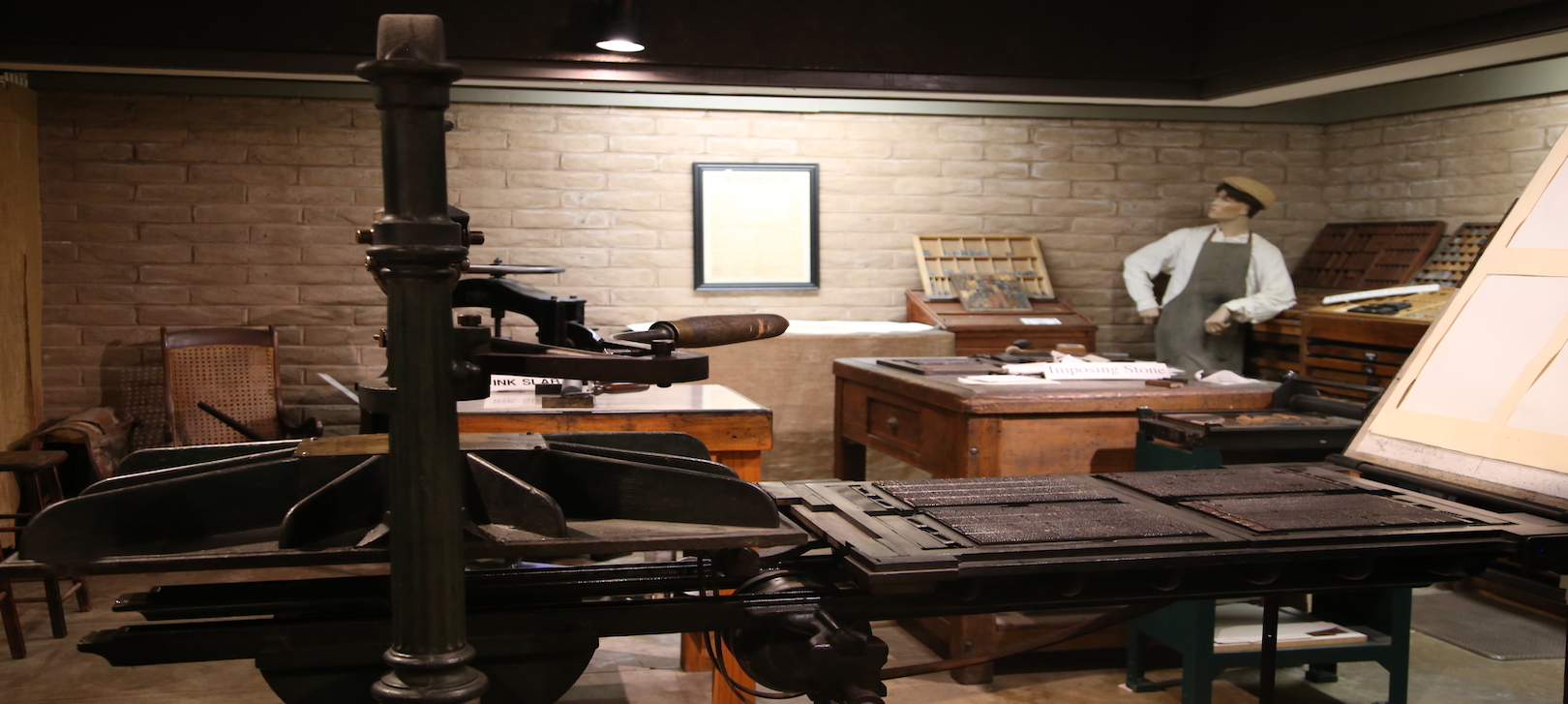 A view of the museum display of Arizona's first printing press inside the Tubac Presidio State Historic Park
