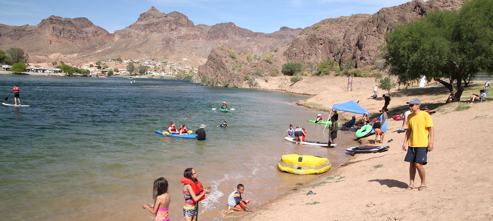 A family swimming in the Colorado River at River Island State Park