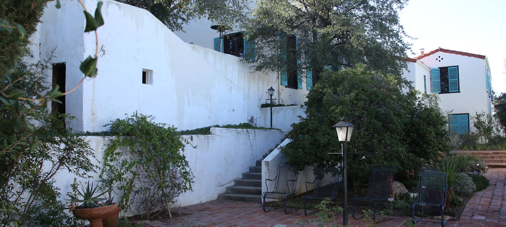 A view of the Kannally Ranch House, with plants nearby