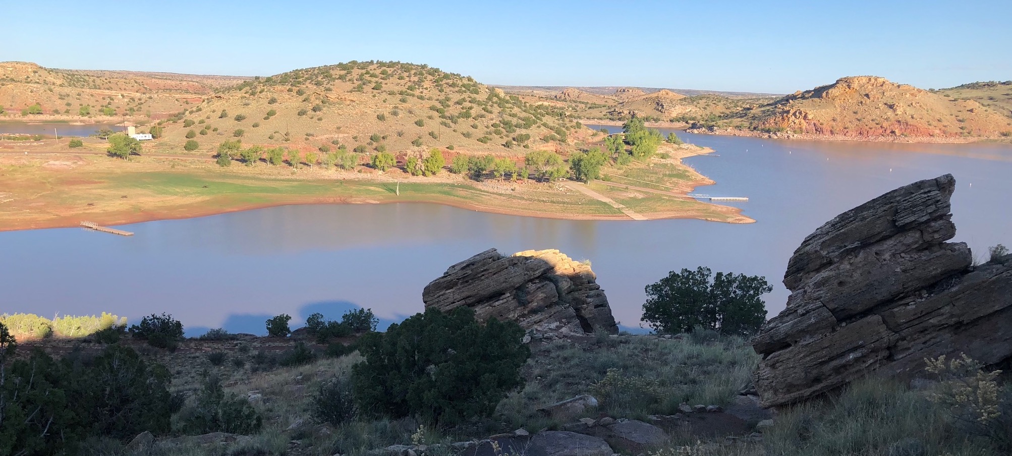 An overview of Lyman Lake, with rocks outlined in the foreground