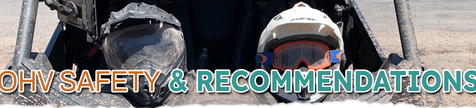 Two people in OHV safety gear ride their machine in the Arizona desert.