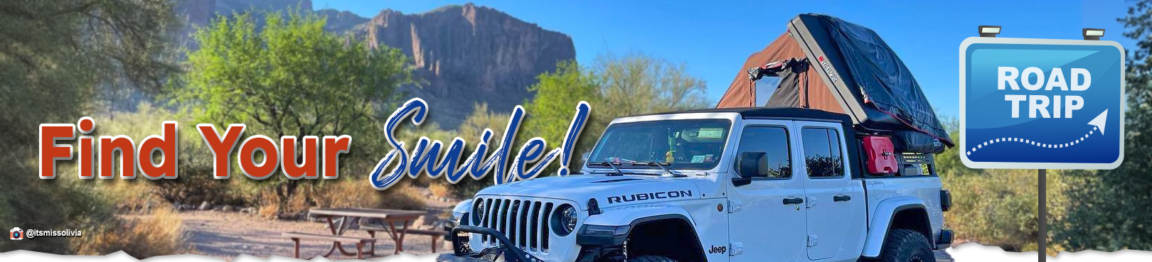 A Jeep with a camper in the back parks at Lost Dutchman State Park. The header reads "find your smile!"