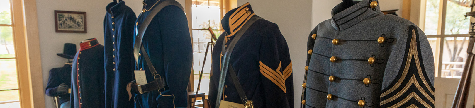 A display of the varied historic uniforms of the Quartermaster Depot staff sits in the main park building.