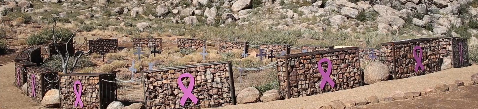 Steel, rock filled gabions surround the fatality site amid the rocky terrain of the area.