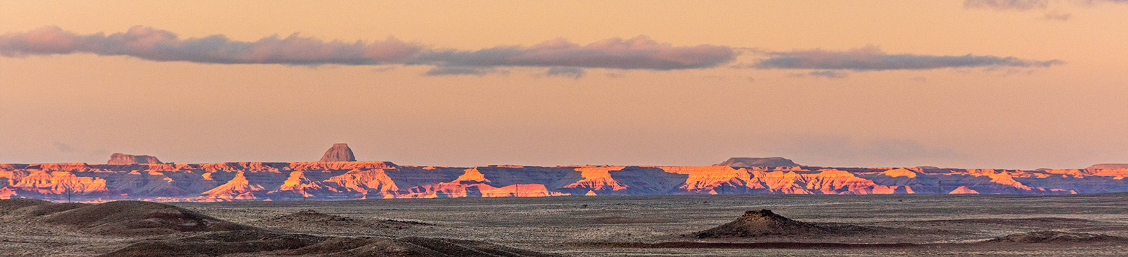 Panoramic view at sunset north from the park into the painted desert in the far distance.