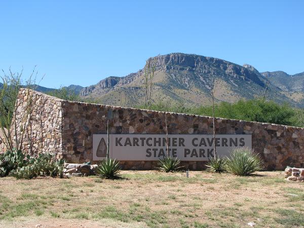 The park sign at the entrance, with the Whetstone Mountains in the background