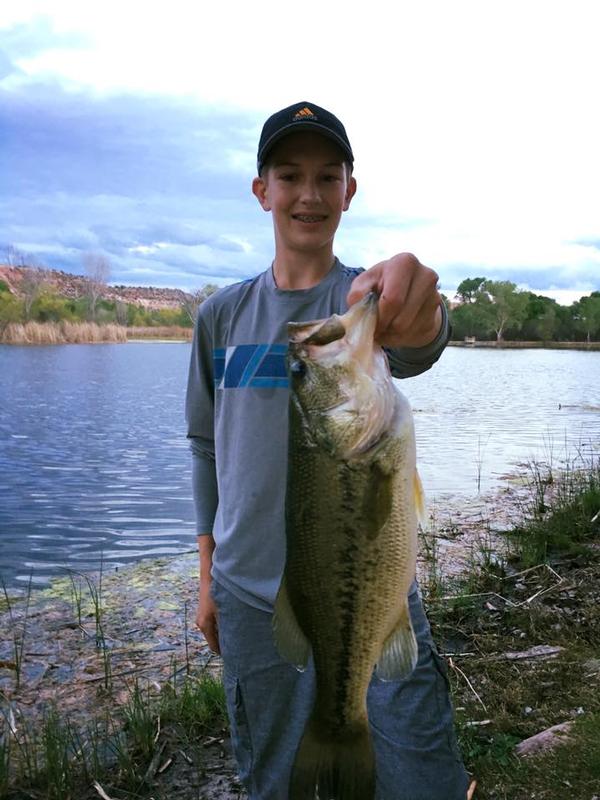 Kid holding a big largemouth from one of the lagoons at Dead Horse Ranch