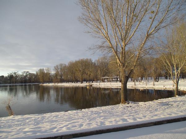 Snow surrounds the lagoon at Dead Horse Ranch State Park