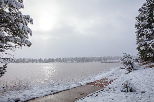 A snowy winter scene around the lake at Fool Hollow Lake recreation area.