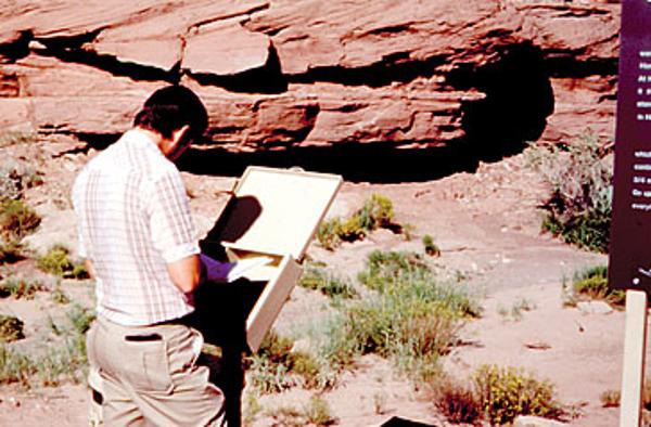 Homolovi State park history- A visitor enjoys an interpretive sign and brochure in 1984