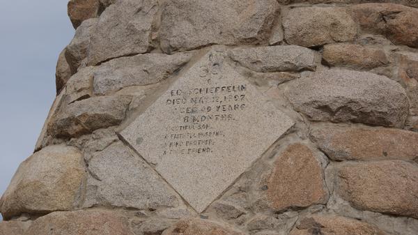 A close-up view of the inscription on the monument for Ed Schieffelin.