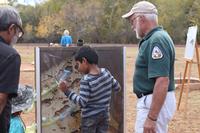 Volunteer educating the public through activities.