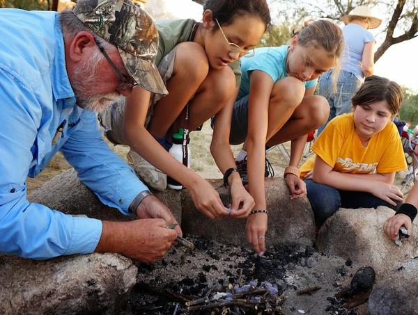 Learning to build a campfire during a weekend campout