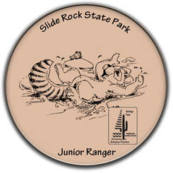 Junior Ranger Button for Slide Rock State Park, featuring Rocky Ringtail