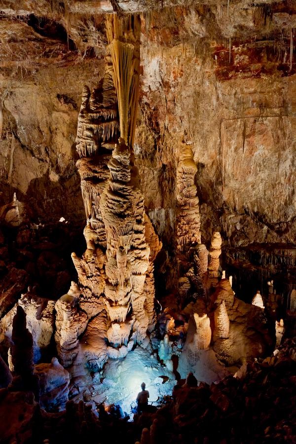 A man looking at Kubla Kahn, A large formation being conserved at Kartchner Caverns. 