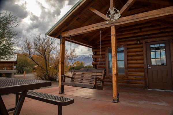 Lakeside Cabin Rental. Voiew of the front of one of the log cabins at the park.