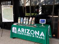 State Parks event table with green logoed tablecloth full of pamphlets
