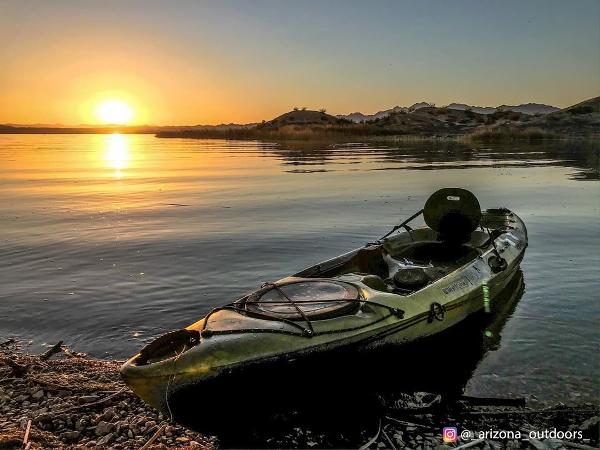 Kayaking in Arizona: kayak parked on the shore of Lake Havasu at sunset