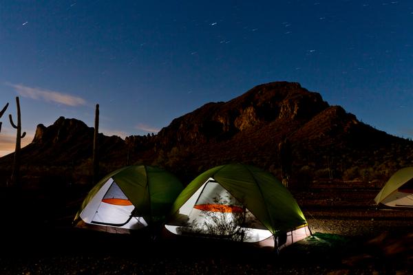 Two tents illuminated at night Summer camping at Picacho Peak State Park 
